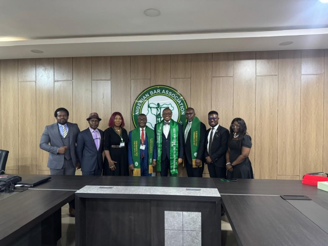 National President AELN Prof S C.DikePhD,FGAN decorated Present of NBA,Mazi Afam Osigwe with Fellow Green Advocate of Nigeria in Abuja today